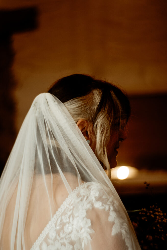 Bride arriving at ceremony at Wonwood Barton Tavistock Devon in lace wedding dress