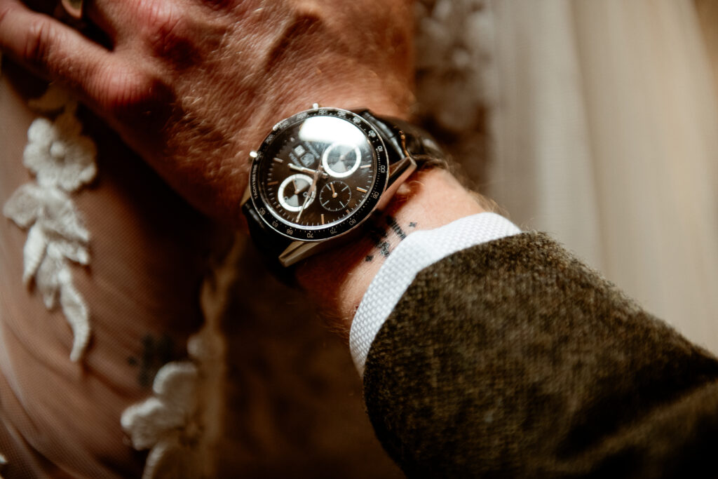 Groom tattooed wrist wedding ring exchange Wonwood Barton Devon wedding photographer