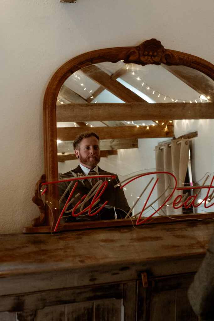 Antique mirror reflection at Wonwood Barton barn wedding venue Tavistock