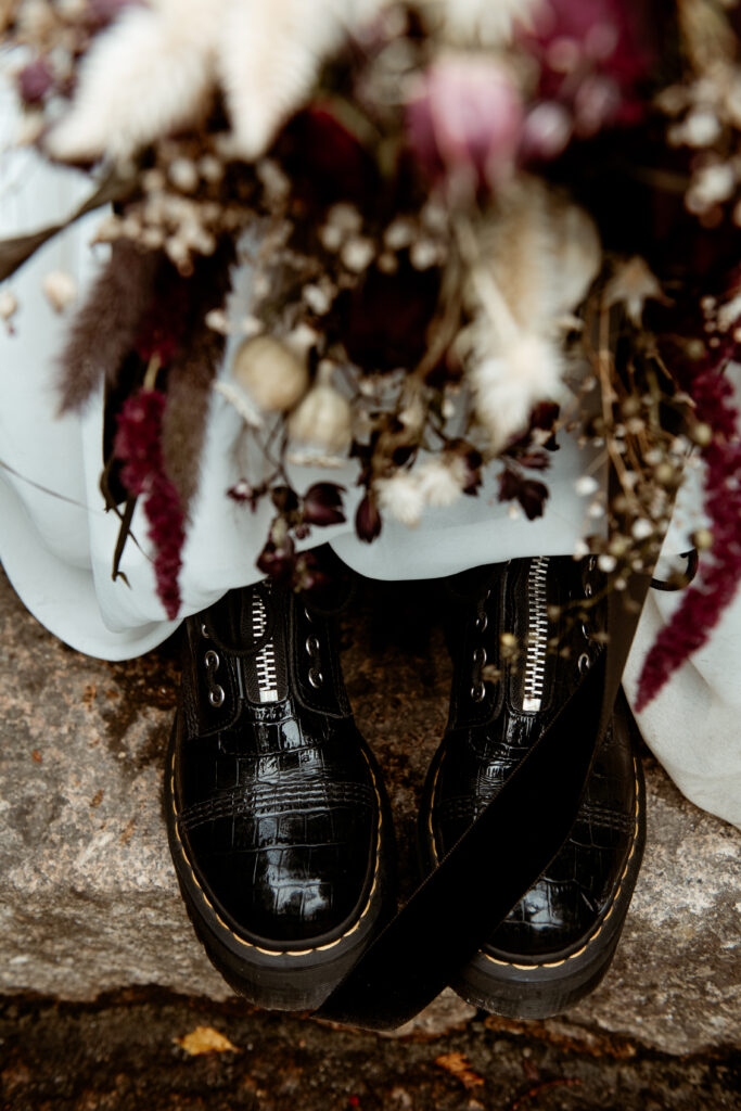 Black croc platform Doc Martens boots with dried flower bouquet eclectic wedding Devon